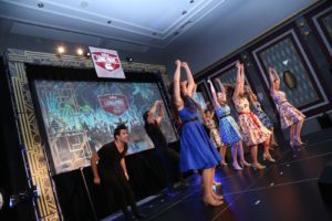 Corporate Entertainment Ideas Broadway Musical Revue Dancers Raised Hands